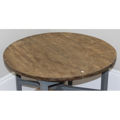 75 - A circular topped pine farmhouse table with grey painted base and scrub top, approx 92cm in diameter... 