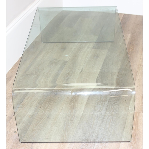 9 - A retro style shaped glass coffee table by Fiam of Italy, etched mark, approx 130cm wide x 70cm deep... 