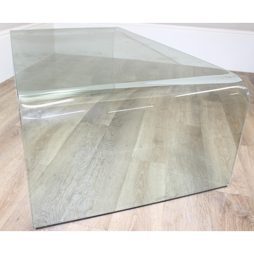 9 - A retro style shaped glass coffee table by Fiam of Italy, etched mark, approx 130cm wide x 70cm deep... 