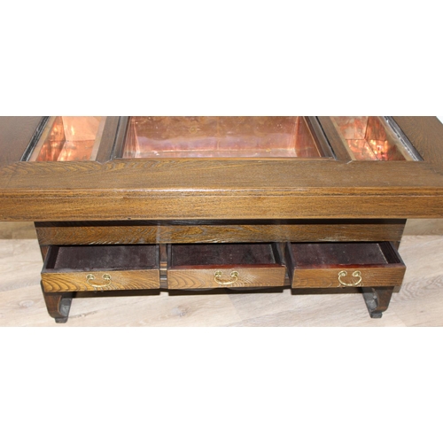 101 - A Japanese hardwood hibachi table with a central copper lined recess flanked by 2 smaller copper rec... 