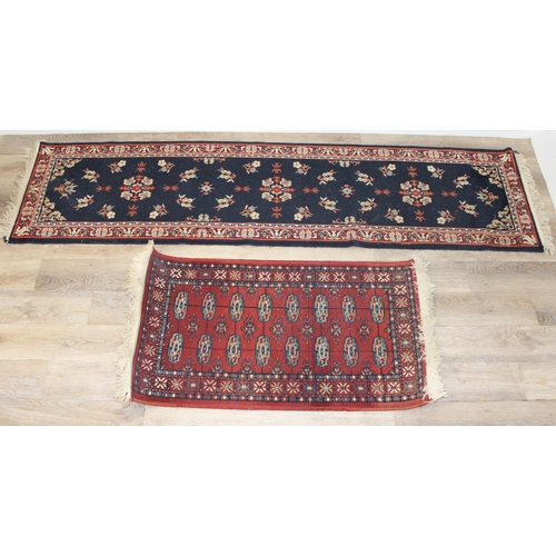 207 - 2 modern rugs, one red and the other a blue hall runner, the runner approx 240cm x 61cm