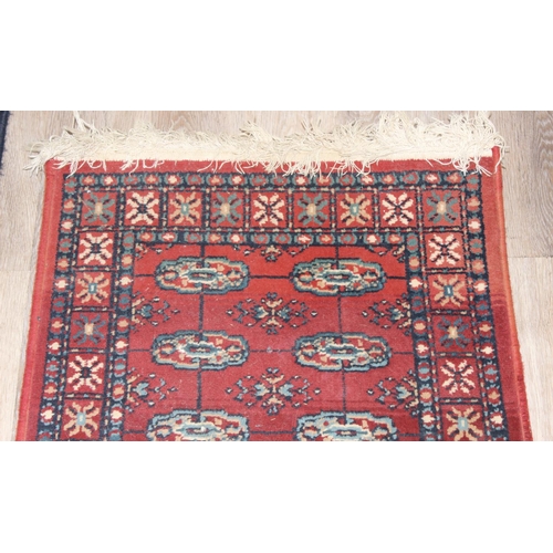 207 - 2 modern rugs, one red and the other a blue hall runner, the runner approx 240cm x 61cm