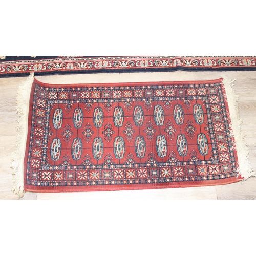 207 - 2 modern rugs, one red and the other a blue hall runner, the runner approx 240cm x 61cm