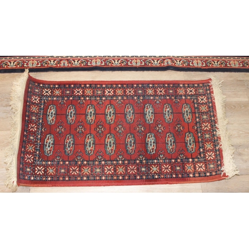 207 - 2 modern rugs, one red and the other a blue hall runner, the runner approx 240cm x 61cm