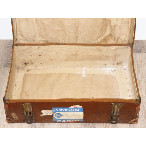 273 - 2 vintage suitcases with a large number of vintage luggage labels, the smaller case leather, the lar... 