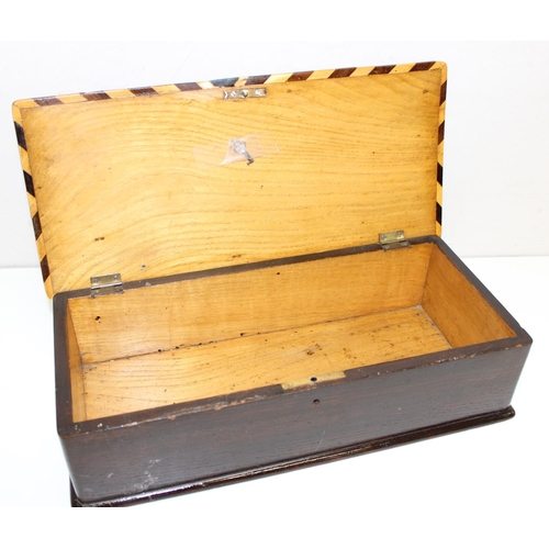 277 - An unusual early 20th century games box, the top formed as a double cribbage board with other marque... 