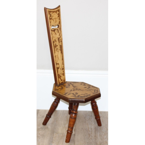 80 - An antique wooden spinning chair with pokerwork lion decoration, approx 87cm tall