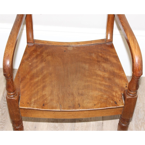 83 - Antique elbow chair with twisted back stretcher, believed to be elm or oak, approx 51cm wide x 84cm ... 