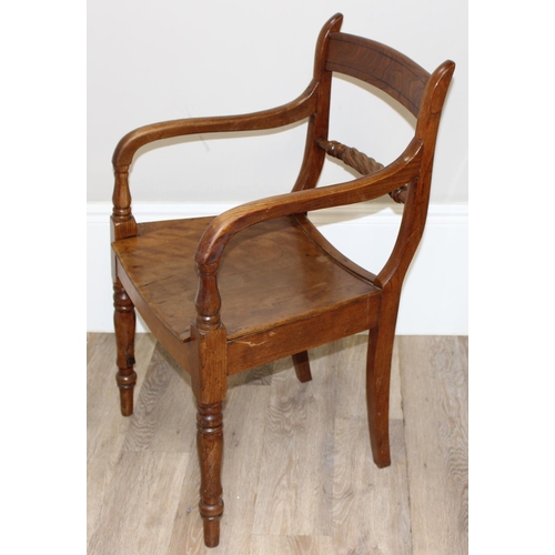 83 - Antique elbow chair with twisted back stretcher, believed to be elm or oak, approx 51cm wide x 84cm ... 