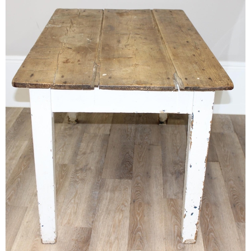 91 - An antique pine rustic farmhouse table with painted base, approx 132cm wide x 74cm deep x 70cm tall