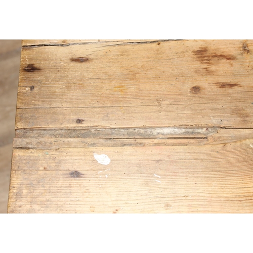 91 - An antique pine rustic farmhouse table with painted base, approx 132cm wide x 74cm deep x 70cm tall