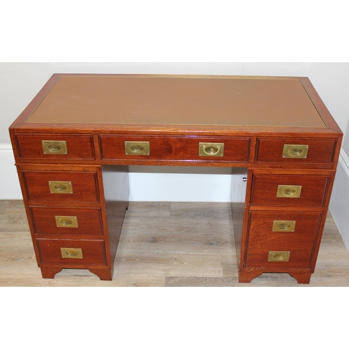 95 - A 20th century Oriental hardwood desk with brass campaign style handles and brown inset leather top,... 