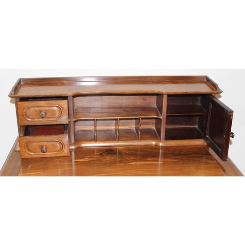 96 - A 20th century Oriental hardwood ladies' desk with 2 lower drawers and a stationary rack top, carved... 