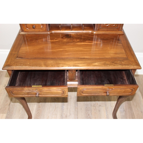 96 - A 20th century Oriental hardwood ladies' desk with 2 lower drawers and a stationary rack top, carved... 