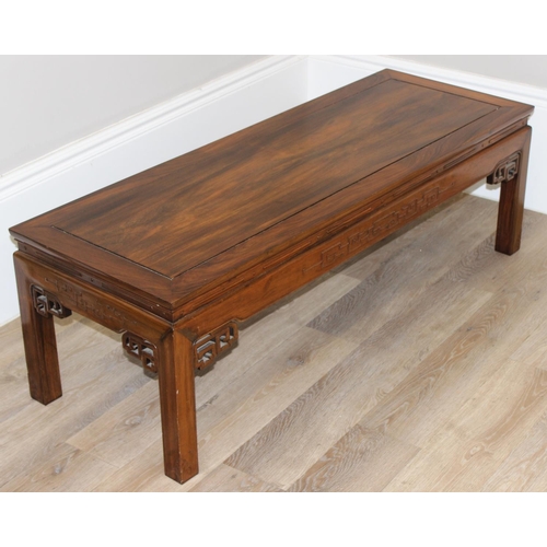 97 - A 20th century Oriental hardwood low or coffee table, carved details, 20th century, approx 127cm wid... 