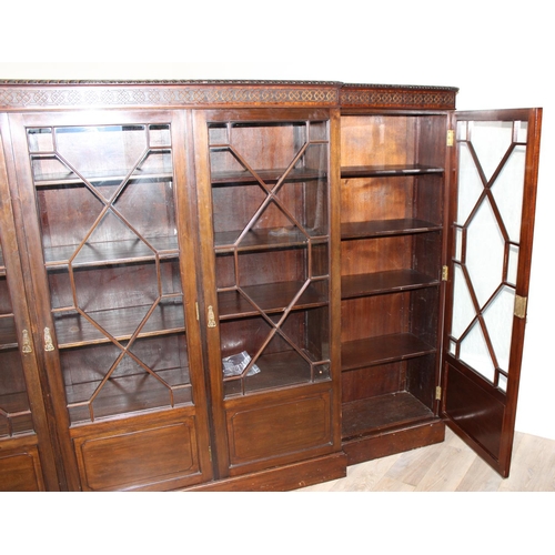 110 - A Chippendale style 5 door mahogany breakfront bookcase with astral glazed doors, approx 275cm wide ... 