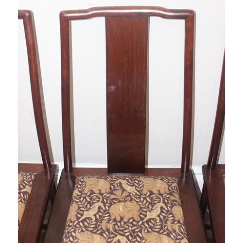 112 - A set of 10 (8 + 2 carvers) Chinese hardwood dining chairs with later animal fabric seats, each appr... 