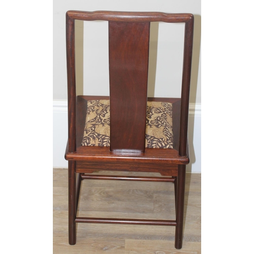 112 - A set of 10 (8 + 2 carvers) Chinese hardwood dining chairs with later animal fabric seats, each appr... 