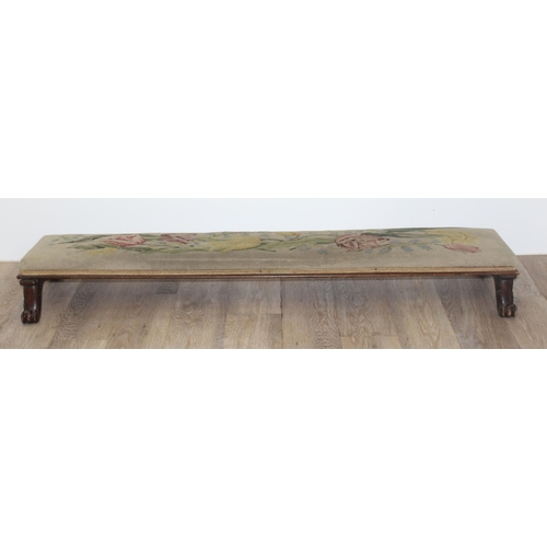 115 - A long low footstool with tapestry top and paw feet and 2 other vintage footstools, the largest appr... 