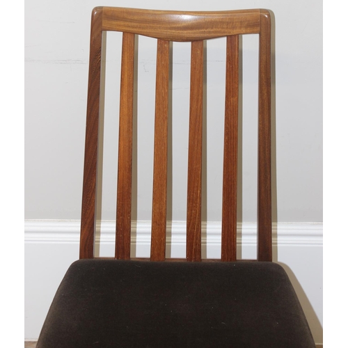 116 - A set of 4 retro 1970's G-Plan teak dining chairs with stuffed brown upholstered seats, each approx ... 