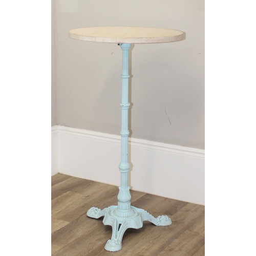 127 - A circular wooden topped Victorian style poseur bar or bistro table on ornate cast iron base, the ba... 