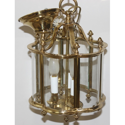 246 - An antique style brass hall lantern with curved glass panels and a distressed metal and etched glass... 