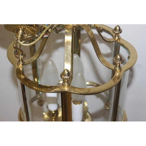 246 - An antique style brass hall lantern with curved glass panels and a distressed metal and etched glass... 