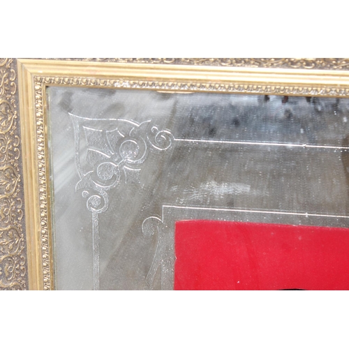 368 - A very large vintage mirror emblazoned with 