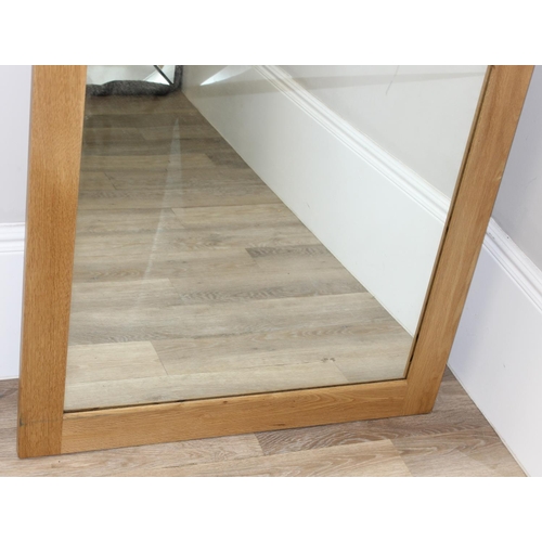 369 - A large light oak framed wall mirror, approx 230cm x 87cm