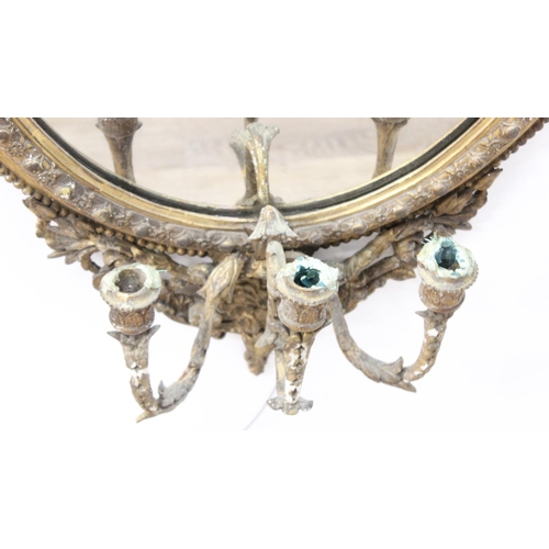 388 - A 19th century gilt framed oval girandole wall mirror, the mirror made from giltwood and gesso with ... 