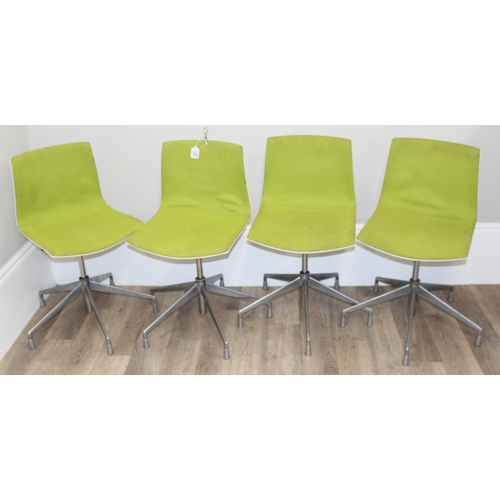 133 - A set of 4 Italian made retro style swivel chairs with metal base and green fabric upholstery, made ... 