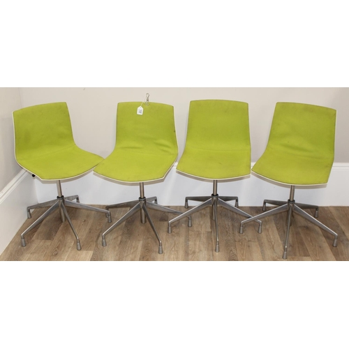 133 - A set of 4 Italian made retro style swivel chairs with metal base and green fabric upholstery, made ... 