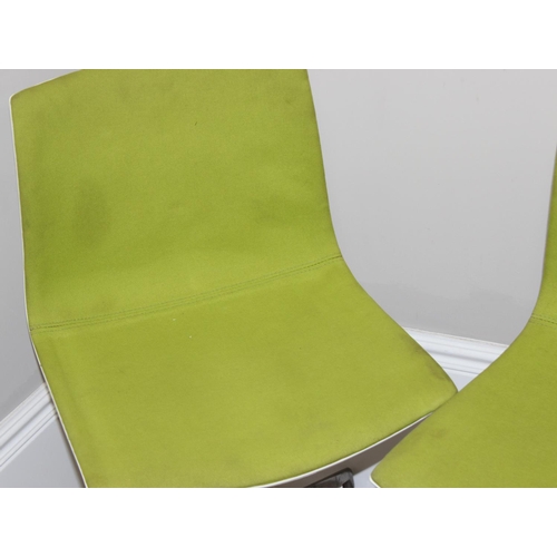 133 - A set of 4 Italian made retro style swivel chairs with metal base and green fabric upholstery, made ... 