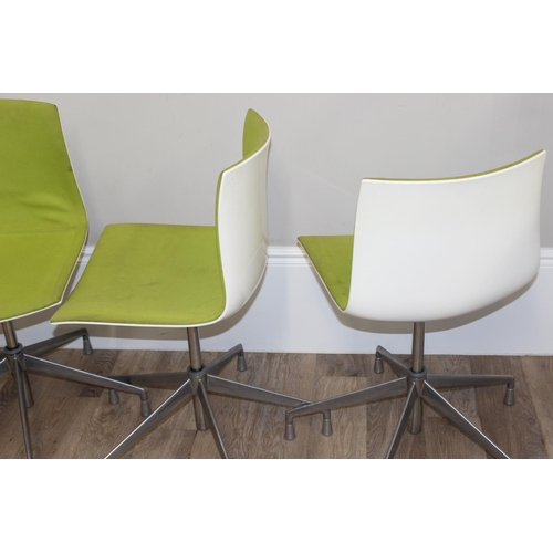 133 - A set of 4 Italian made retro style swivel chairs with metal base and green fabric upholstery, made ... 