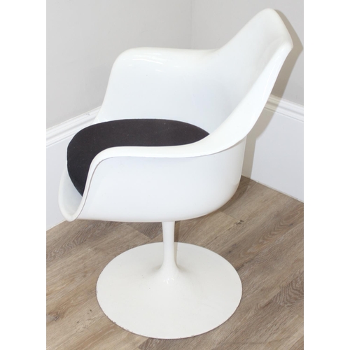 139 - A retro style white tulip plastic moulded chair designed originally by Eero Saarinen, with label for... 