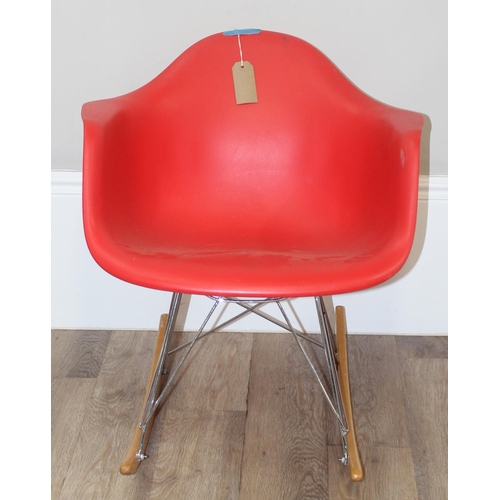 141 - A retro style plastic moulded office chair on wirework base, approx 77cm tall and a similar red moul... 