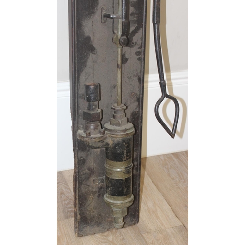 144 - A vintage wall mounted iron garden water pump on wooden plaque, approx 122cm tall