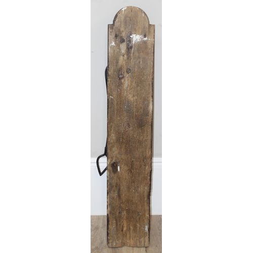 144 - A vintage wall mounted iron garden water pump on wooden plaque, approx 122cm tall