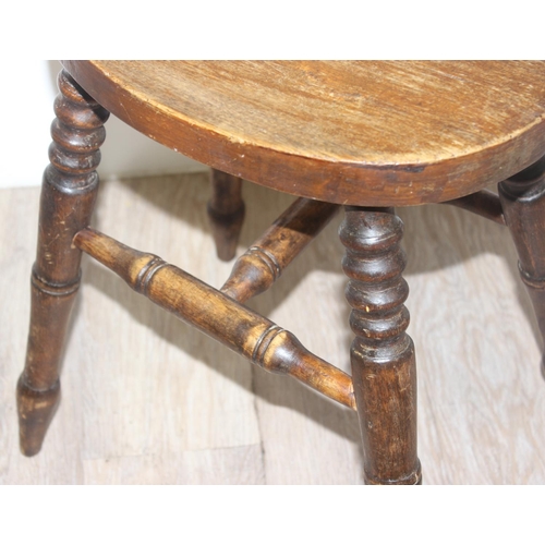 149 - An antique wooden stool with turned legs, approx 46cm tall