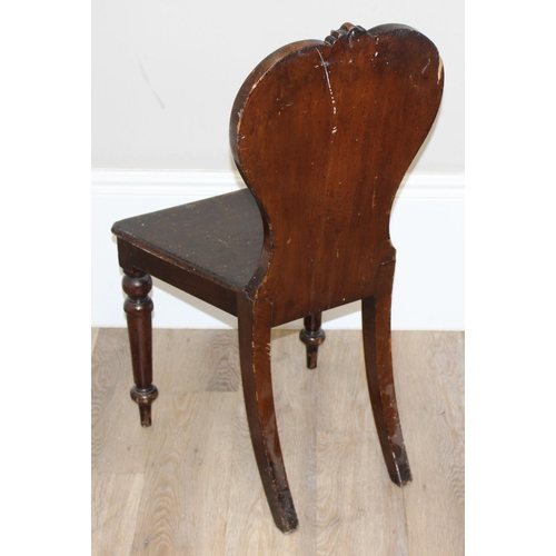 151 - A 19th century stained pine hall chair, approx 85cm tall