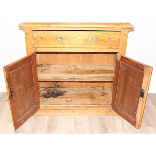 153 - An antique pitch pine dresser of slim proportions, the top with glazed doors, over a single drawer w... 