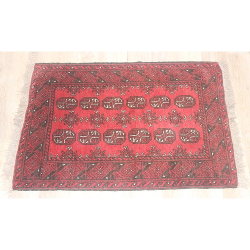 217 - Small hand woven red ground Bokhara style rug by Tariq Sultan & Co, approx 120cm x 82cm