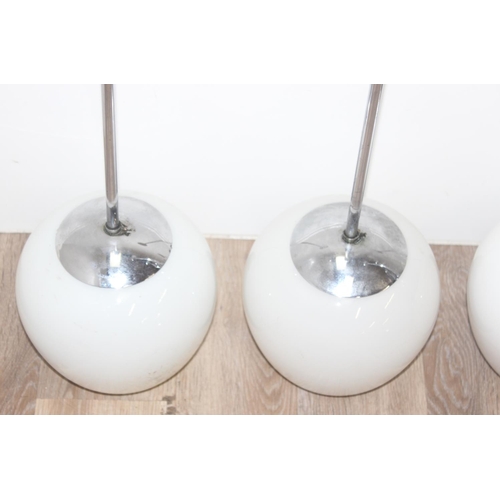 248 - 8 assorted retro style chrome and opaque glass ceiling lights, each approx 84cm tall, with 2 spare s... 