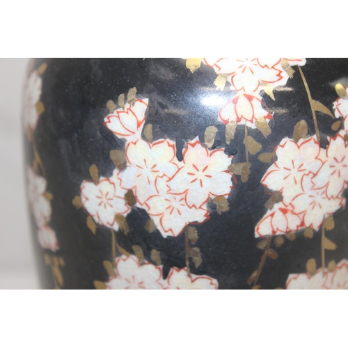 252 - An Oriental black glazed and floral decorated table lamp, possibly Japanese, approx 40cm tall