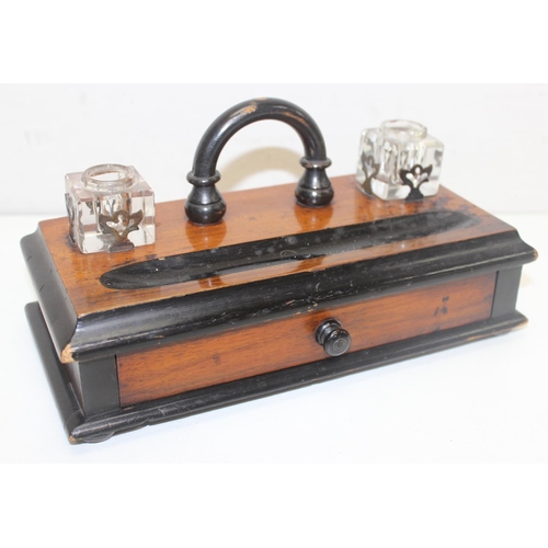 281 - An antique walnut writing slope with brass corners, a mahogany and ebonised desk stand with 2 inkwel... 