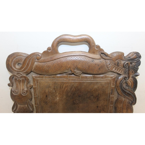 282 - An early 20th century Oriental carved wooden tray decorated with dragons, approx 46cm x 30cm