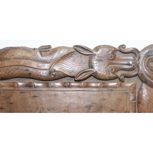 282 - An early 20th century Oriental carved wooden tray decorated with dragons, approx 46cm x 30cm