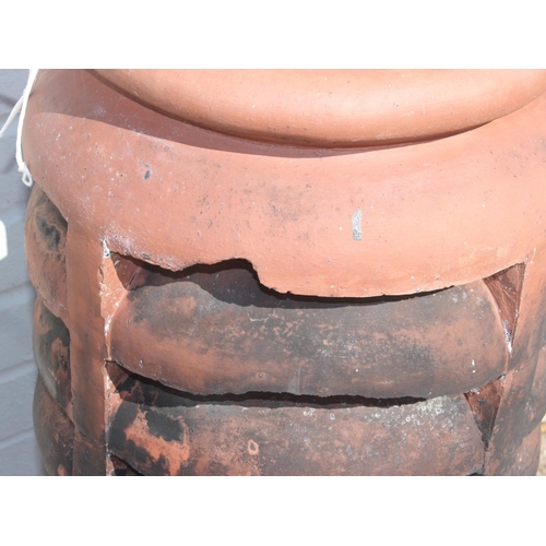 302 - An antique terracotta chimney pot, approx 86cm H