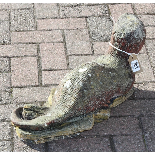 303 - A painted concrete garden ornament of an otter, approx 58cm long