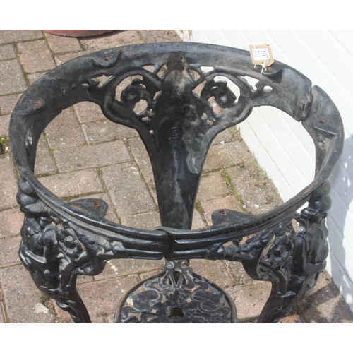 311 - An antique style cast iron pub or tavern table base, no top, approx 48cm in diameter x 69cm tall